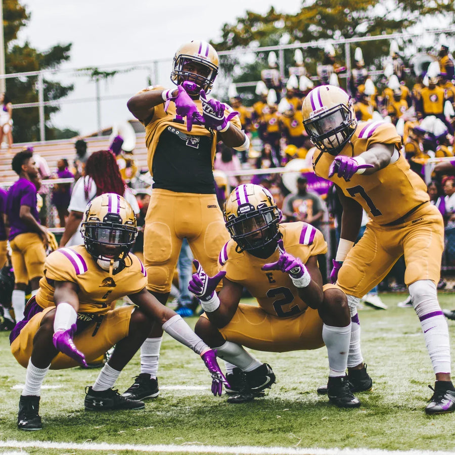 group of football players posing for a picture
