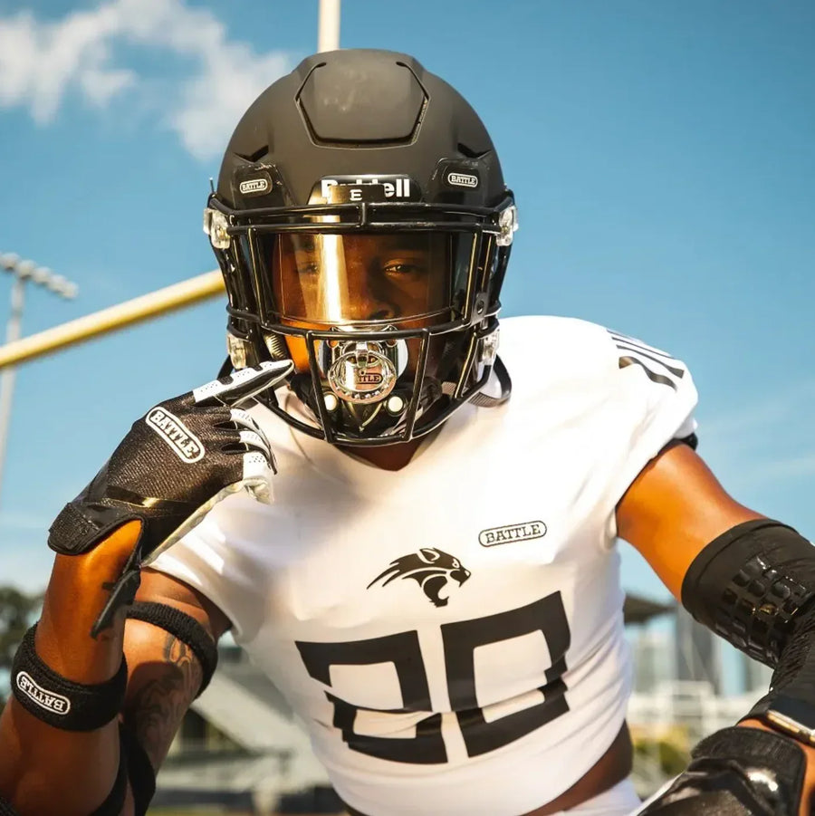 Football player wearing the Battle binky mouthguard