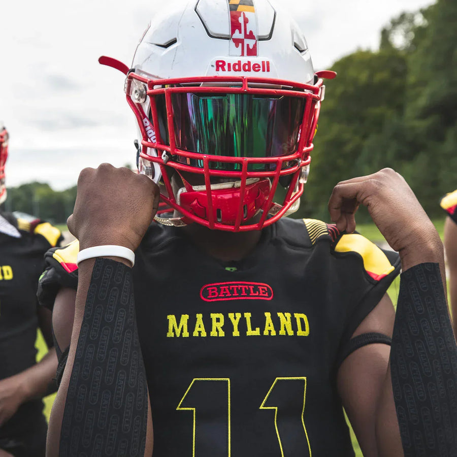 football player wearing turf tape on forearms