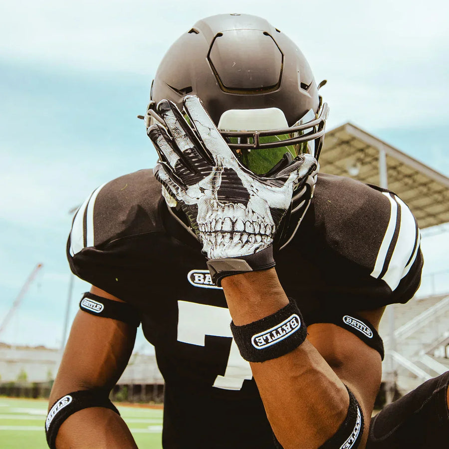Man with skull Battle gloves in football uniform