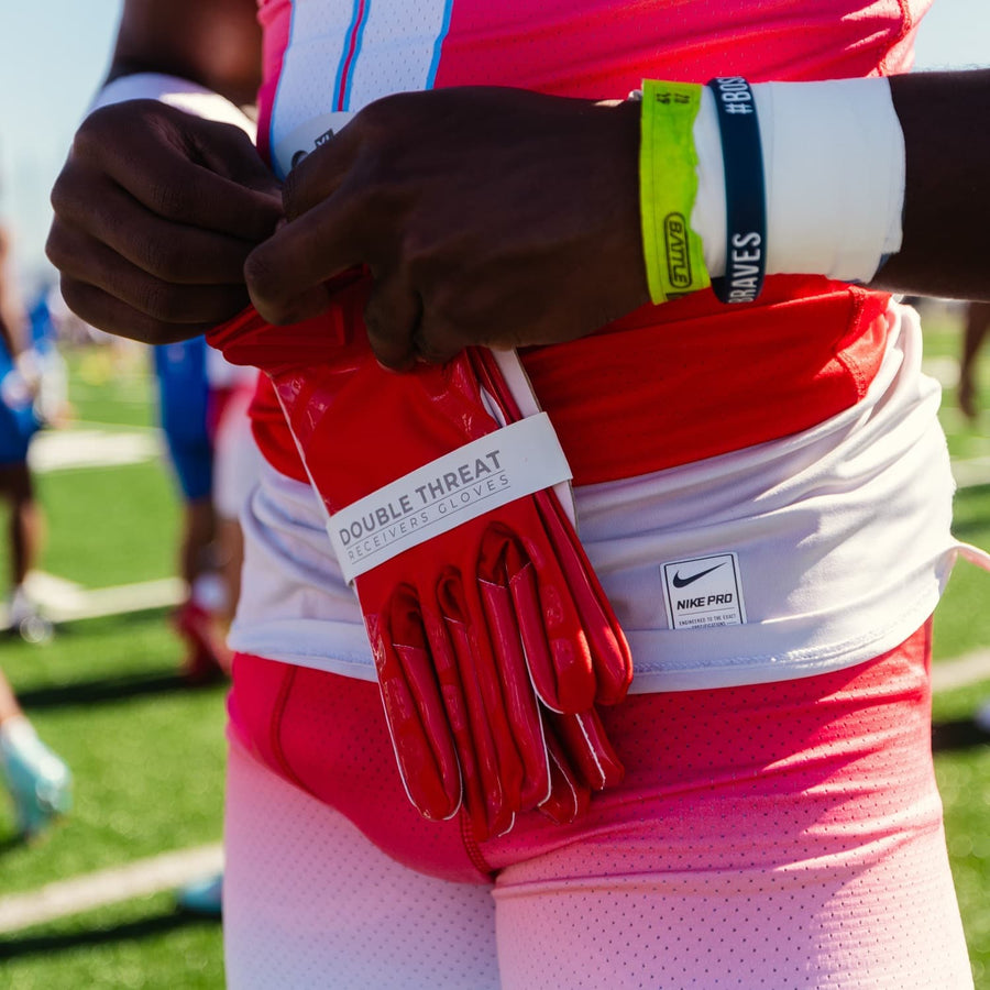 Player holding a new pair of football gloves