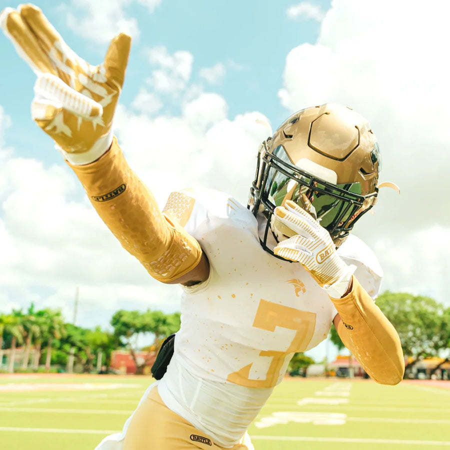 man wearing battle football accessories