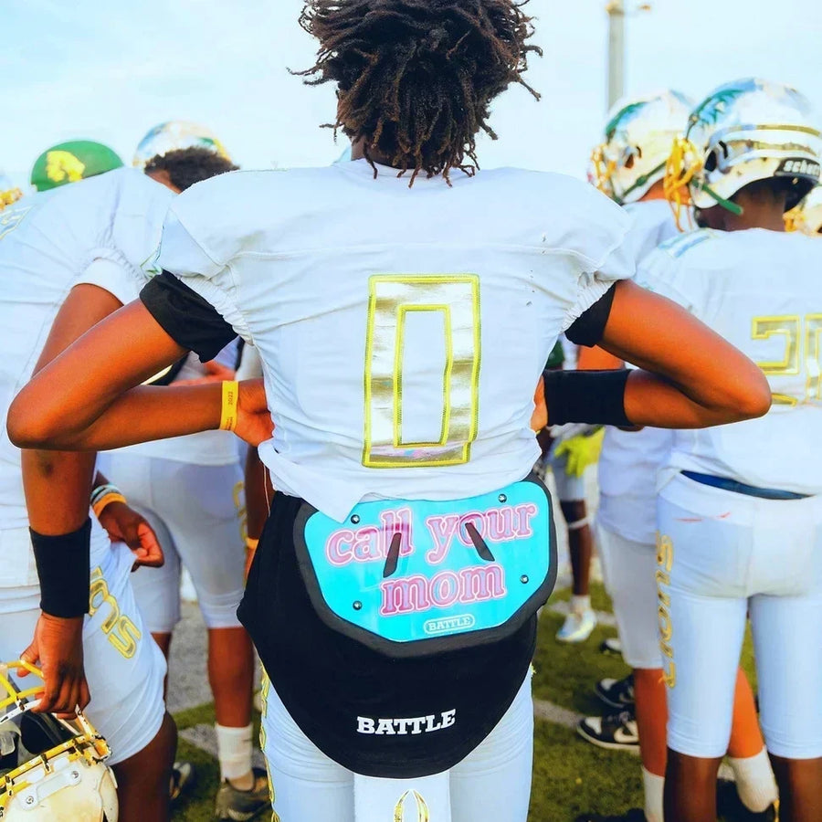 Football player wearing a Battle Call Your Mom back plate