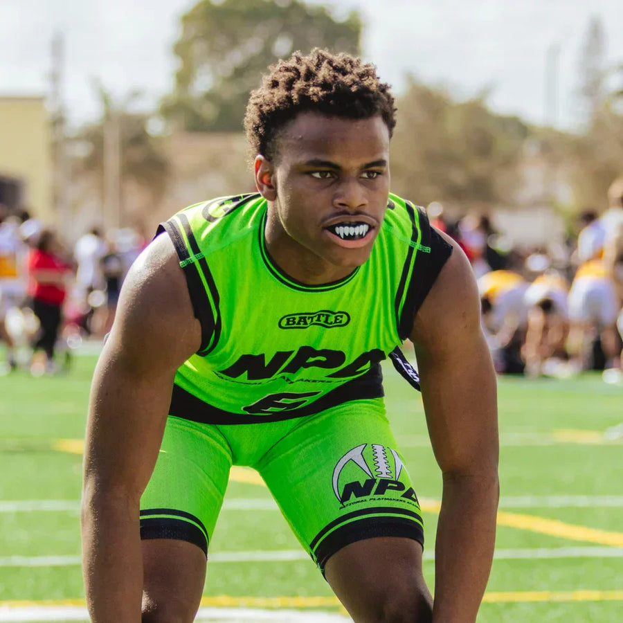Football player wearing fangs mouthguard
