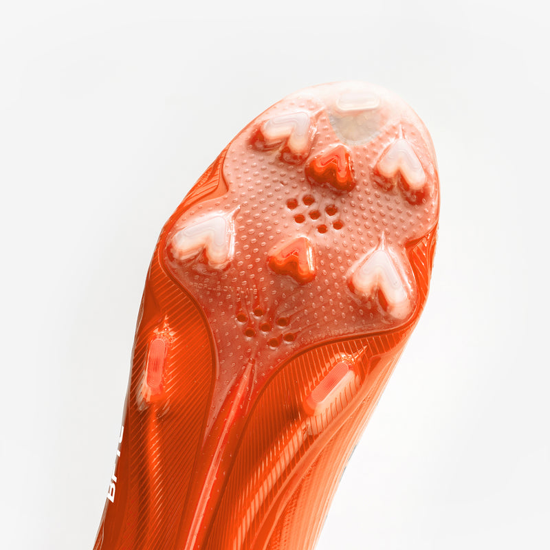 A pair of bright orange football cleats with white 'BATTLE', displayed on a clean white background.