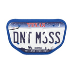 Texas license plate with 'DON'T MISS' text on a white background