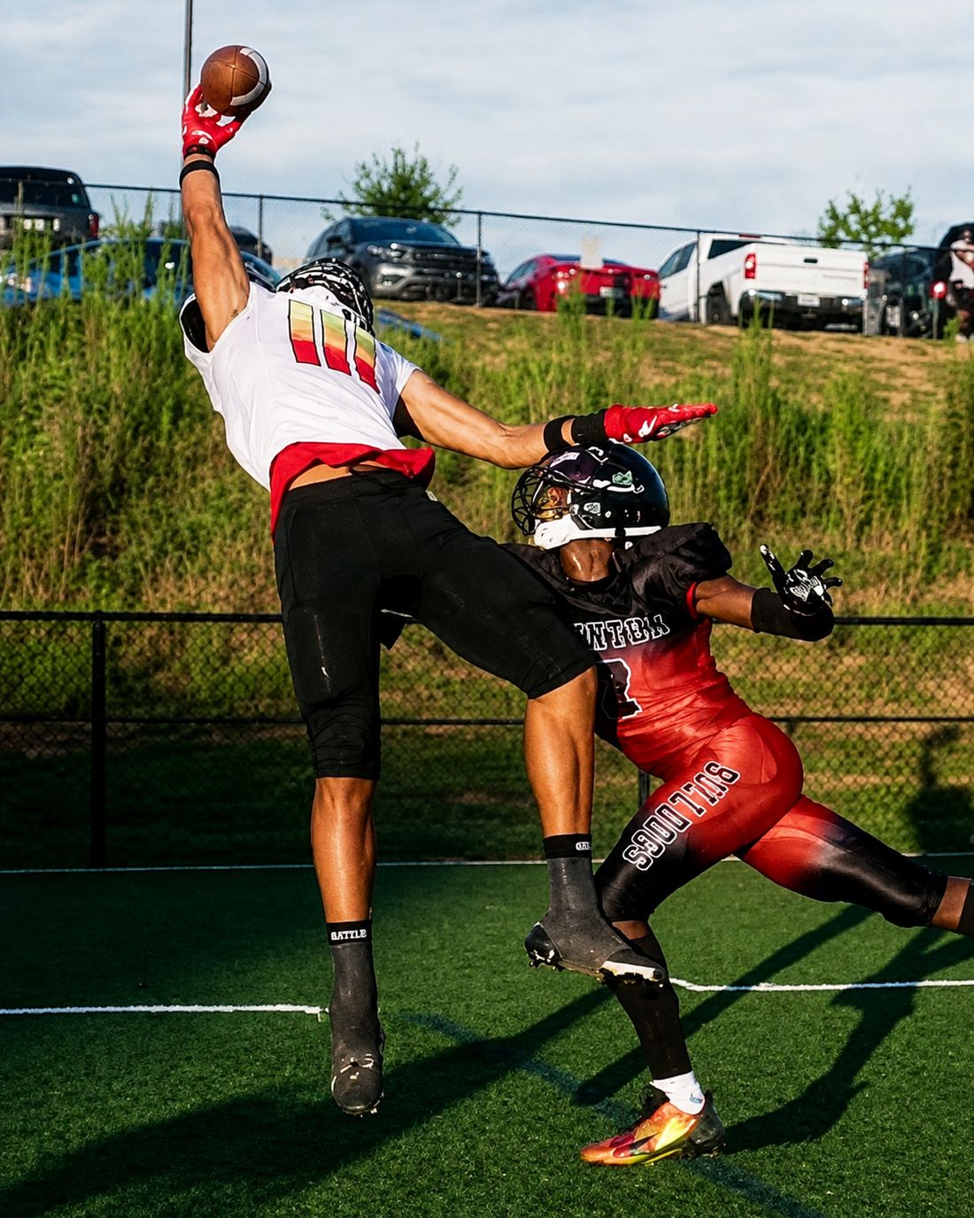 One-handed contested catch in a number III jersey