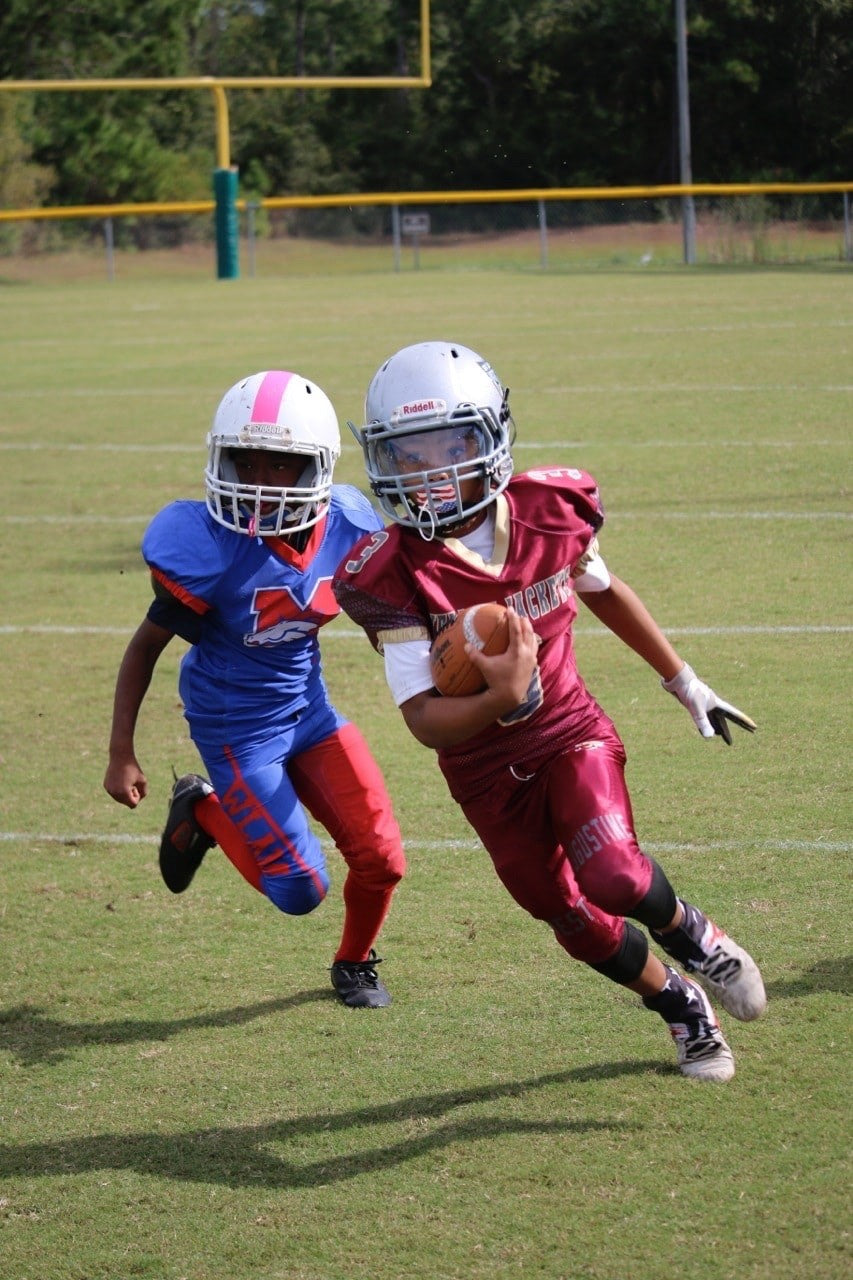 Brysen Wright as a youth football player in a Jackets uniform